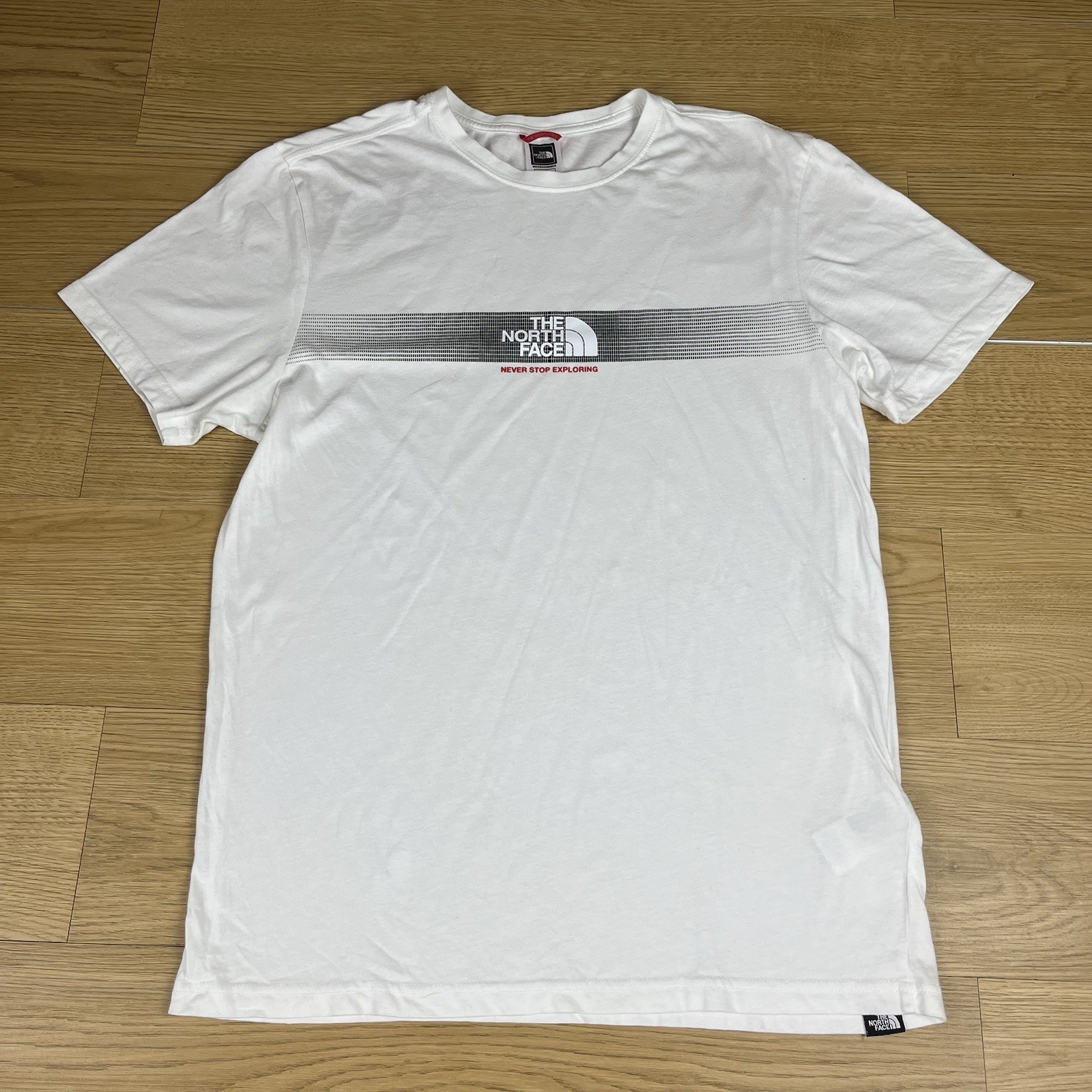 Camiseta para hombre The North Face blanca con logotipo gráfico talla M "Never Stop Exploring"