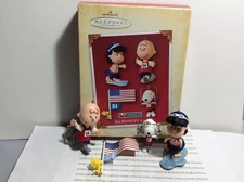 THE PEANUTS GAMES HALLMARK ORNAMENT 2004 NEW IN BOX SET OF FOUR ORNAMENTS