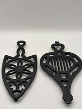 Vintage Black Cast Iron Trivets EM10 152 and 150