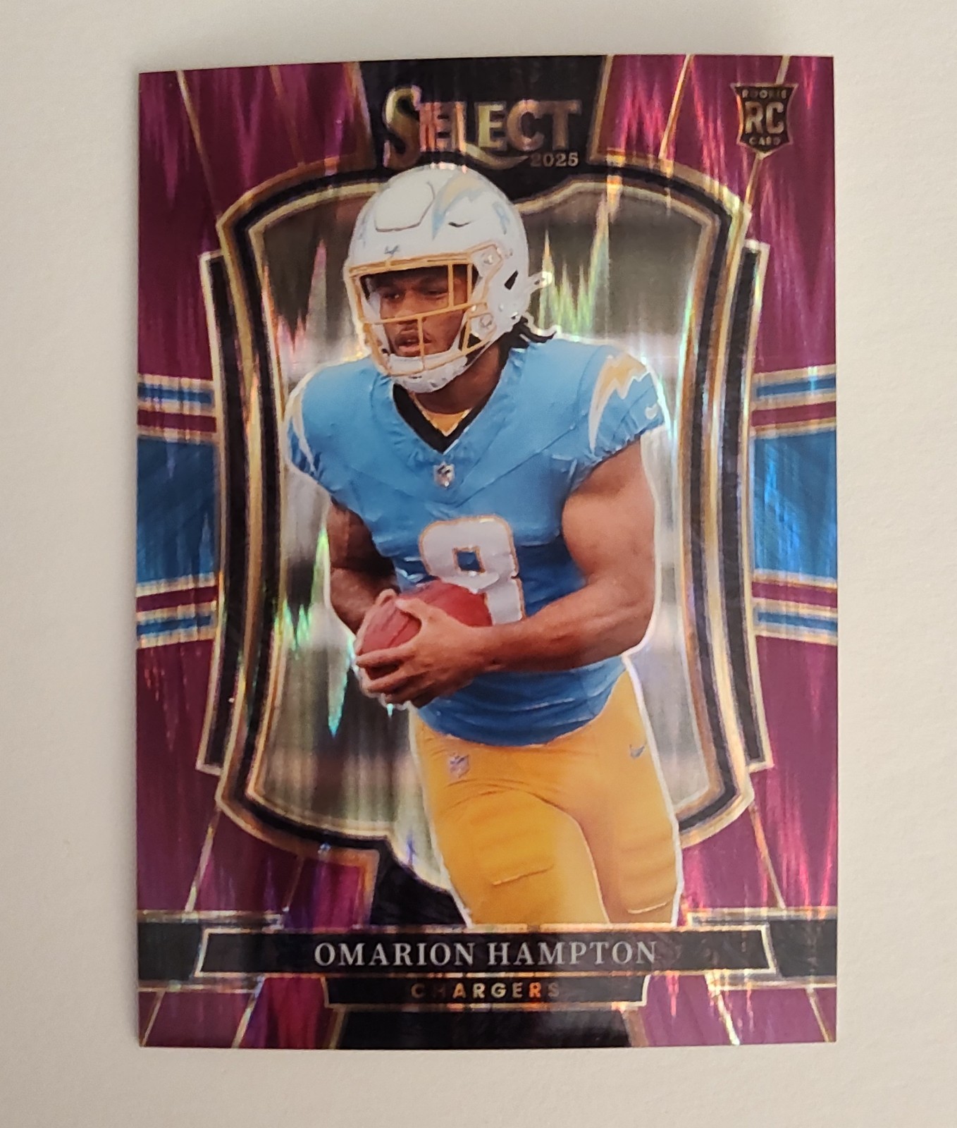 2025 Select #102 Omarion Hampton Purple Prizm Shock #636/699 Las Angeles Charger
