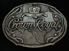 PL19123 NOS VINTAGE 1970s  CROWN ROYAL  BOOZE BRASSTONE BELT BUCKLE
