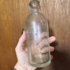 American Steam Bottling Co. Clear Hutchinson Style Embossed Soda Bottle — photo 3