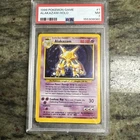 1999 POKEMON BASE SET UNLIMITED #1 ALAKAZAM-HOLO PSA 7