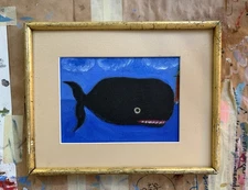 Small Black Whale Swimming In The Sea