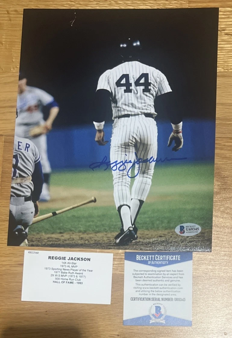 A Smoltz card signed by Reggie Jackson. With his Pic on back. Weird