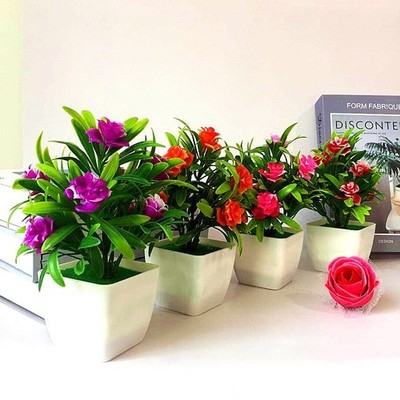 Schöne künstliche Zimmerpflanze Lilienblume und Tannenzapfen Hochwertig