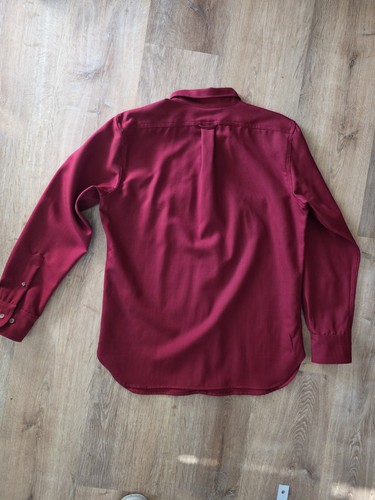 Red and black Filson virgin wool guide shirt with long sleeves, button-down collar, and front pocket on back.