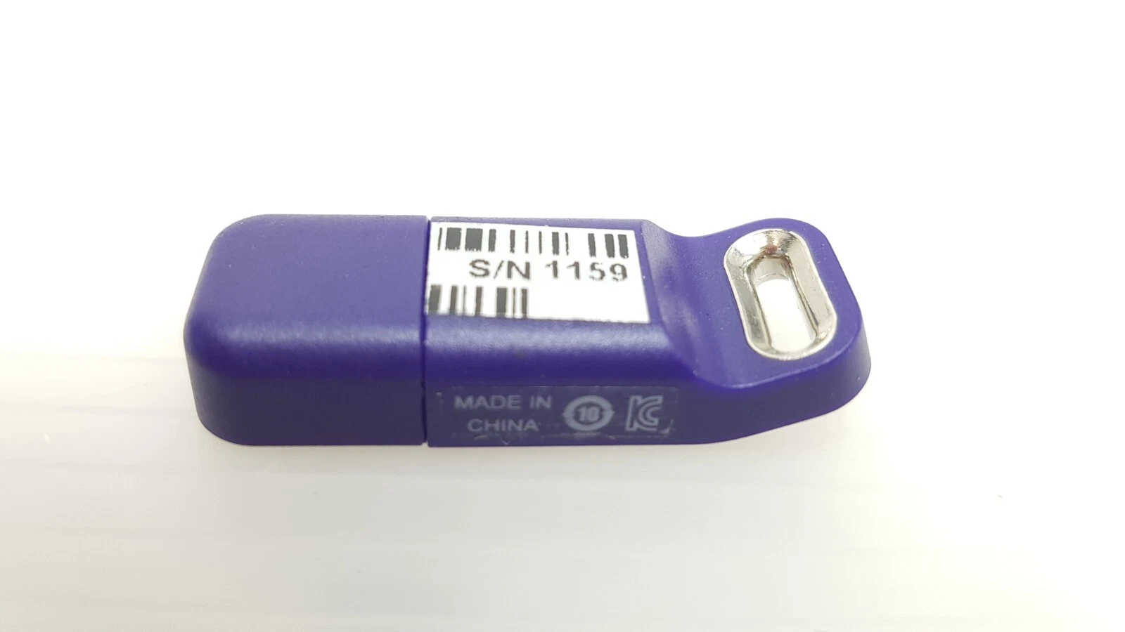 Reverse of the LightSheer Desire USB key with barcode label and Made in China mark