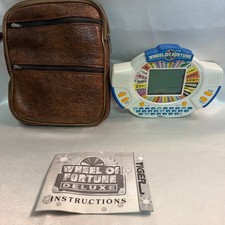 Wheel Of Fortune Handheld Electronic Game by Tiger Electronics 1995 Tested Works