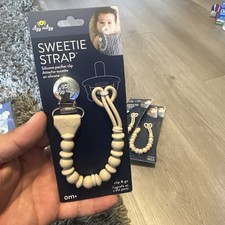 Itzy Ritzy Pink Sweetie silicone Pacifier Strap earth tone gray tan