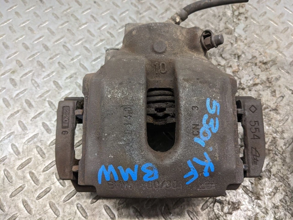 Pinza de freno delantera BMW E38 740IL 740I E39 E83 E53 con par de portadores OEM 1172737 Foto 4 de 4