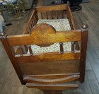 1800s antique Wooden Rocking Cradle Brown with Floral Mattress — photo 3