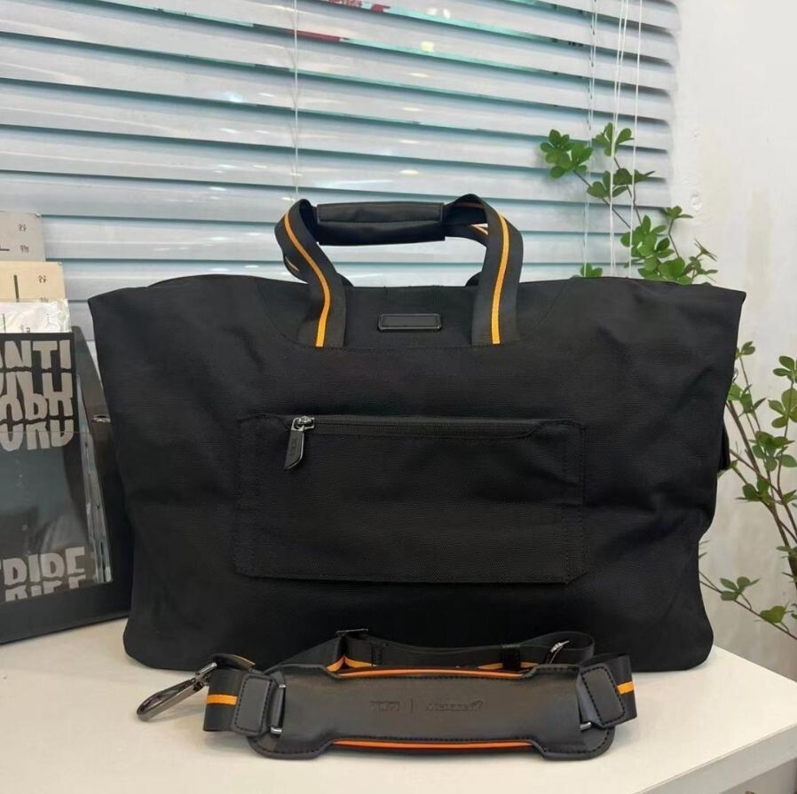 TUMI McLaren M-Tech 2way Soft Satchel Fashion Bag in Orange