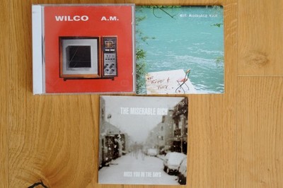 Wilco CD: A.M. (plus 2 Miserable Rich Promo CDs), guter Zustand.