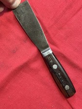 COOL OLD RUSSELL 1540E WOOD HANDLED SEMI STIFF 7” X 1 1/4” PUTTY KNIFE USA MADE