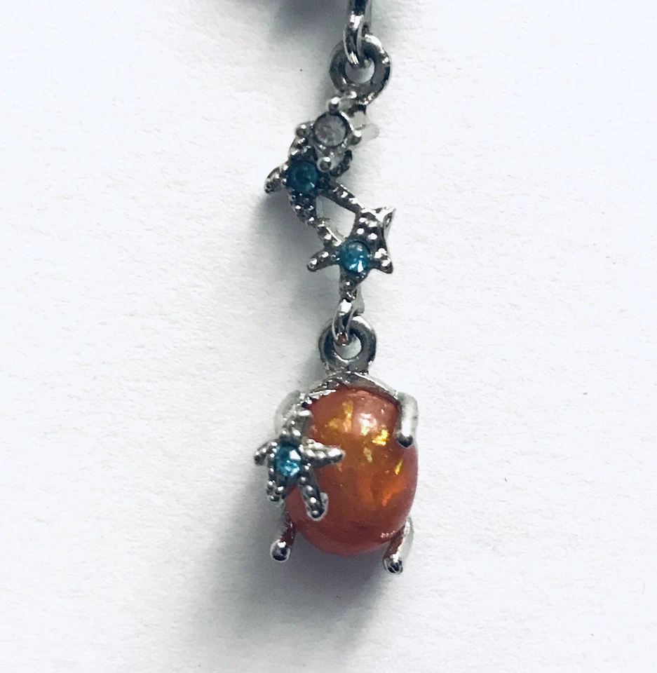 Pendientes colgantes estrellas de mar tono plata pequeños pedrería imitación ópalo cabujón Foto 3 de 4