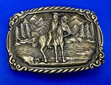 Tall In The Saddle Western Cowboy Horseback Riding Mountain Scene Belt Buckle