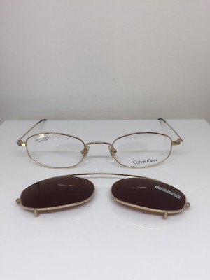 New VINTAGE CALVIN KLEIN Eyeglasses CK 145 Gold With Sun Clip On