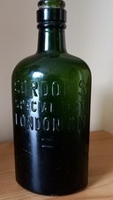 Antique Gordons Special Dry Gin Dark Green  7.5 Inches Tall Very Well Embossed.