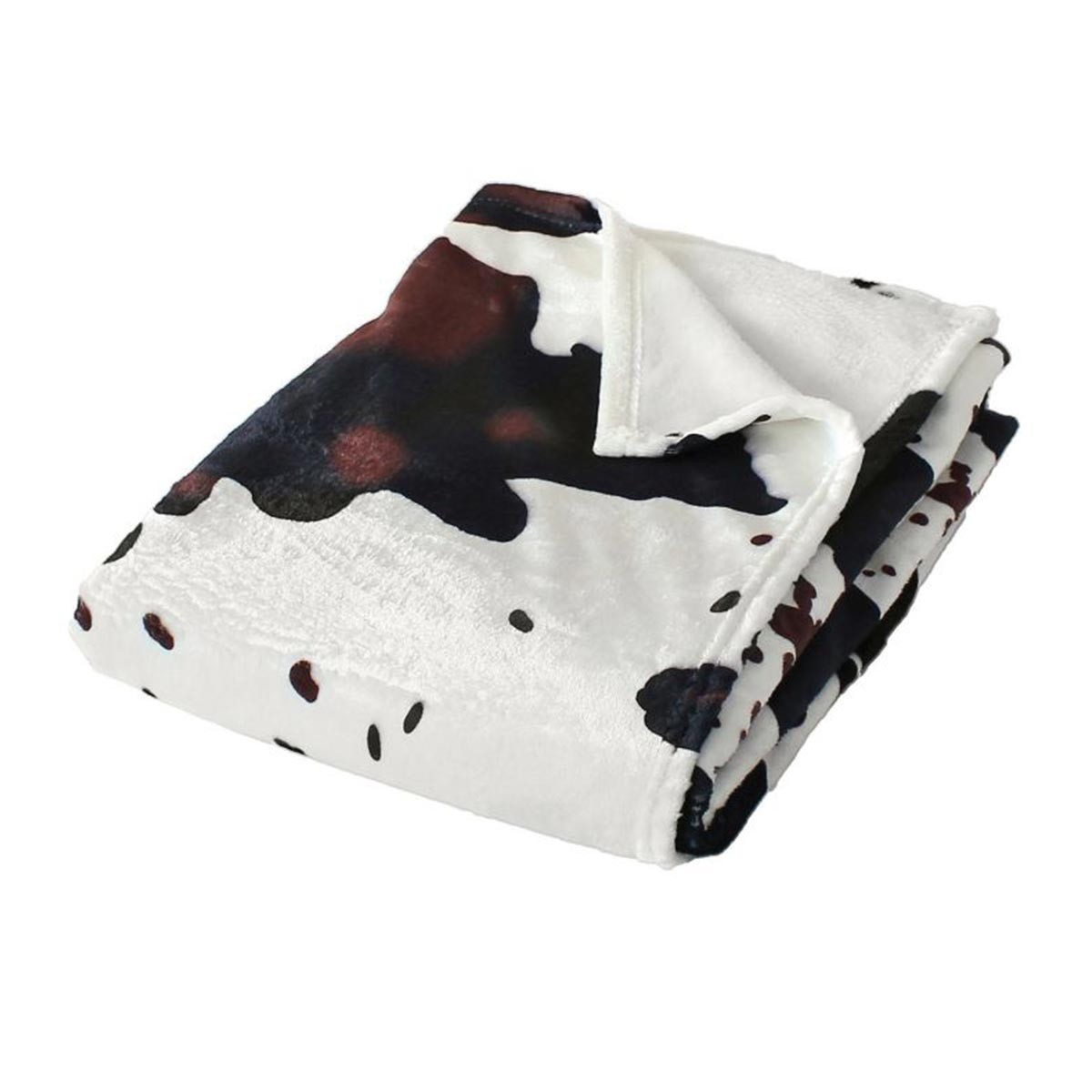 Plaid en flanelle vache contre les frissons du soir dans le fauteuil