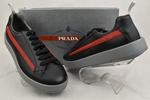 red and black prada sneakers