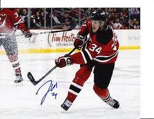 NEW JERSEY DEVILS JON MERRILL SIGNED TAKING SHOT 8X10