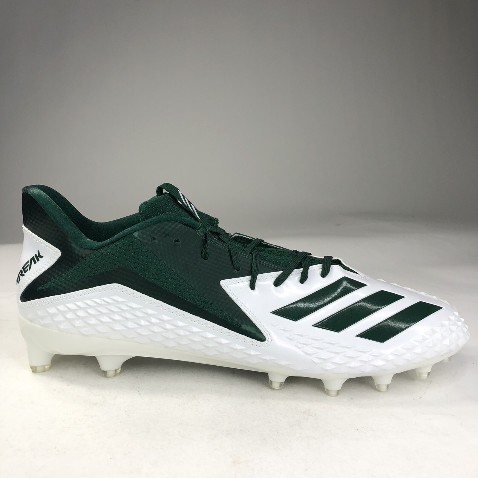 white and green adidas football cleats