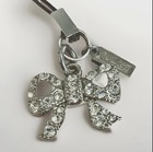 Coach Pave Crystal Embellished Silver Bow Ribbon Mobile Cell Phone Bag Charm