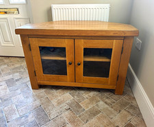 Corner TV Stand Unit Brown Wood with 2 Hinged Glass Doors, Shelf, Cable Mgmt