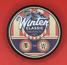 2015 WINTER CLASSIC DUELING HOCKEY PUCK CHICAGO BLACKHAWKS VS Washington Capital