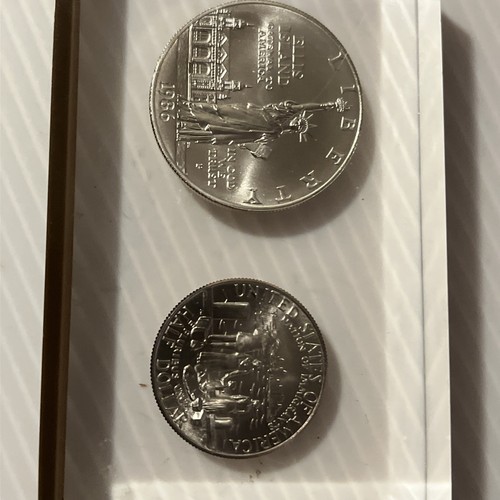 Two Coin On Acrylic Display Case One Dollar 1986 and Half Dollar 1986 Coins