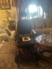electric wheelchair red black practically new plug-in