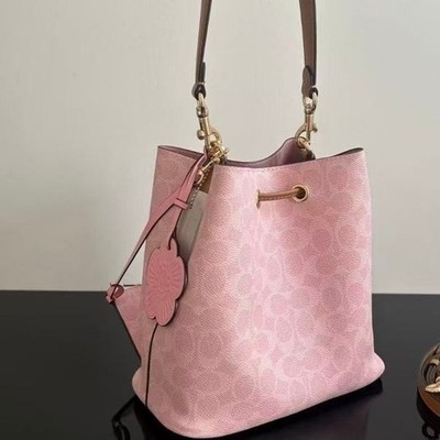 Coach CEA23 Rowan Bucket Bag In Signature Canvas With Charms Powder Pink