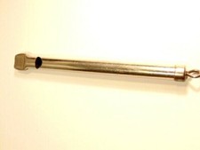 mechanical steel color metal whistle with plunger device at end