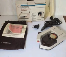 Norelco TI70 Travel Iron/Spray/Steam/Dry Iron Folding Handle Dual Voltage NEW