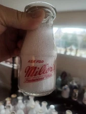 MILLER'S DAIRY CREEDMOOR ONTARIO CA.  HALF PINT RED PYRO WAR BOTTLE 💥