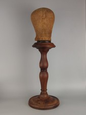 Antique hat stand milliners shop display with canvas head block