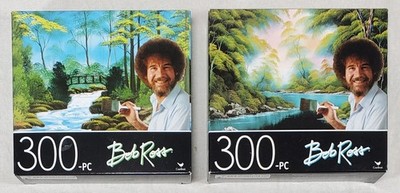 Lot Of 2 BOB ROSS 300 Pc. Jigsaw Puzzles SECLUDED BRIDGE & DEEP FOREST LAKE 