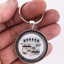 Llavero vintage de 1,2" de diámetro con placa de escudo de cubierta de rueda tapacubos Cadillac de los años 60