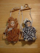 Two Swinging Porcelain Head Dolls
