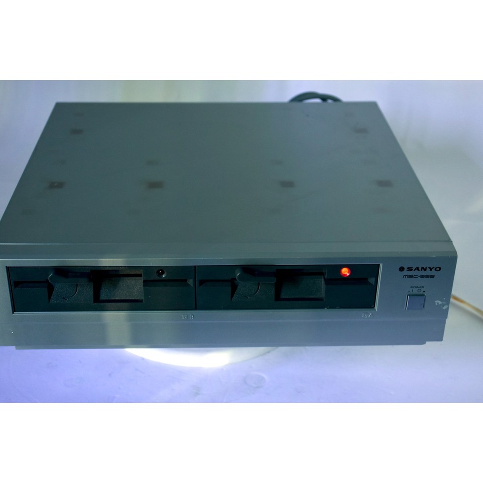 A Sanyo MBC-555 dual-floppy personal computer from the early PC era that still powers on — a working relic of the pre-IBM-clone wars.