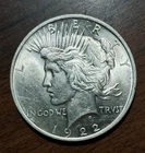 1922 P  Peace Silver Dollar.  BU/ Au 58. 90% Silver.  A White Dazzler!!