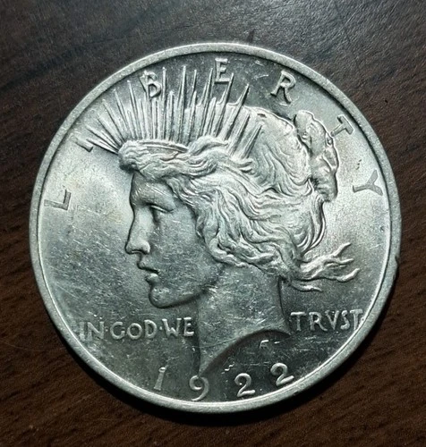 1922 P  Peace Silver Dollar.  BU/ Au 58. 90% Silver.  A White Dazzler!!