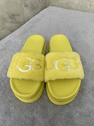 yellow laton ugg slides
