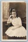 c1910's Child Girl Curly Hair Bow Ribbon Studio RPPC Photo Antique Postcard
