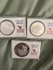 1988 Santa Claus. Snowman, and Toys Festive Wreath 1 ounce .999 Silver Round (3)
