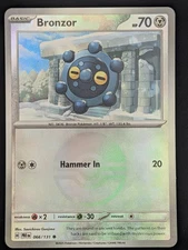 Bronzor (Poke Ball Pattern) (066/131) SV: Prismatic Evolutions Pokemon NM