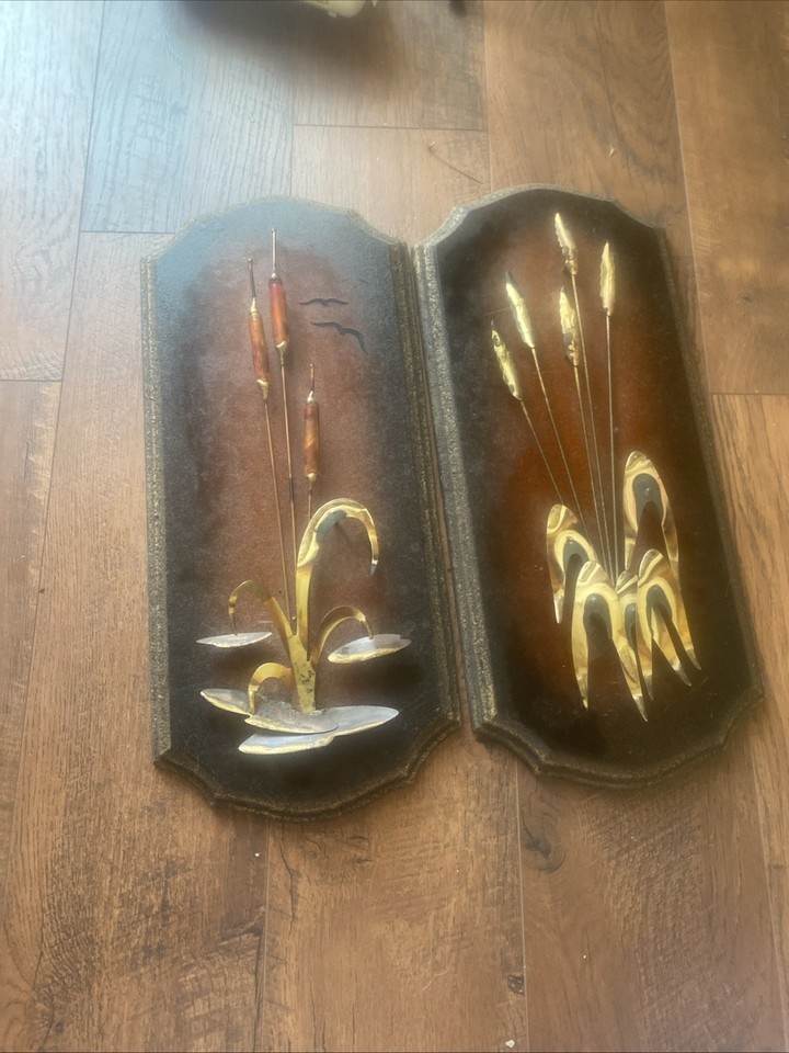 A vintage copper/brass 3D cattails and reeds wall plaque set — hyper-specific MCM botanical art that feels like a museum-quality score from a 1960s sunroom.