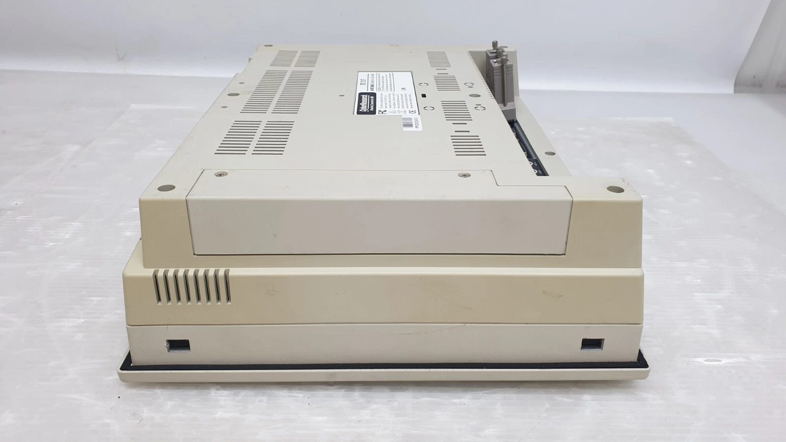 Side of the STC 12-T housing with the adapter screws visible at the rear edge