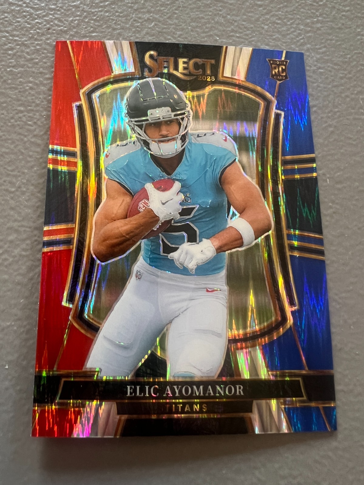 2025 Panini Select - Elic Ayomanor TITANS Rookie Blue & Red Shock Prizm #127